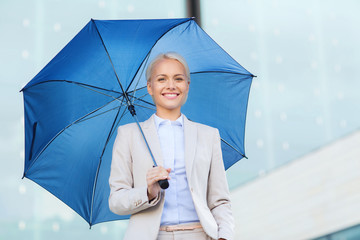 Sticker - young smiling businesswoman with umbrella outdoors