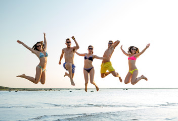 Sticker - smiling friends in sunglasses on summer beach