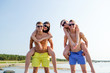 © Syda Productions - smiling friends in sunglasses on summer beach