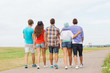 © Syda Productions - group of teenagers walking outdoors from back