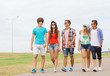 © Syda Productions - group of smiling teenagers walking outdoors