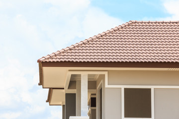 roof under construction with stacks of roof tiles for home build