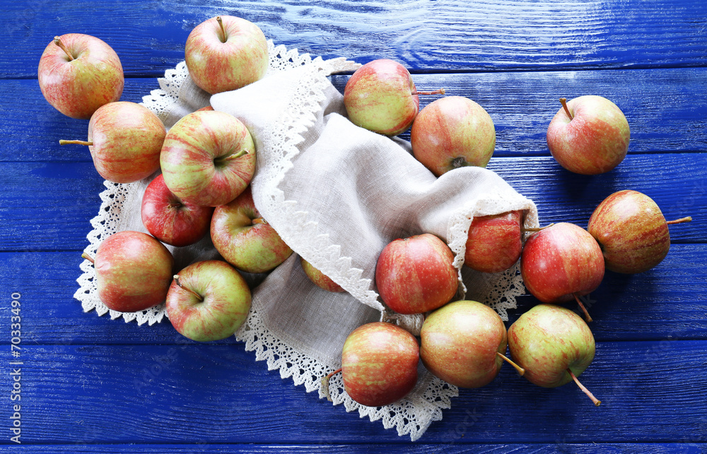 Juicy apples on wooden table, close-up