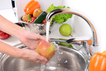 Wall Mural - Washing fruits and vegetables close-up