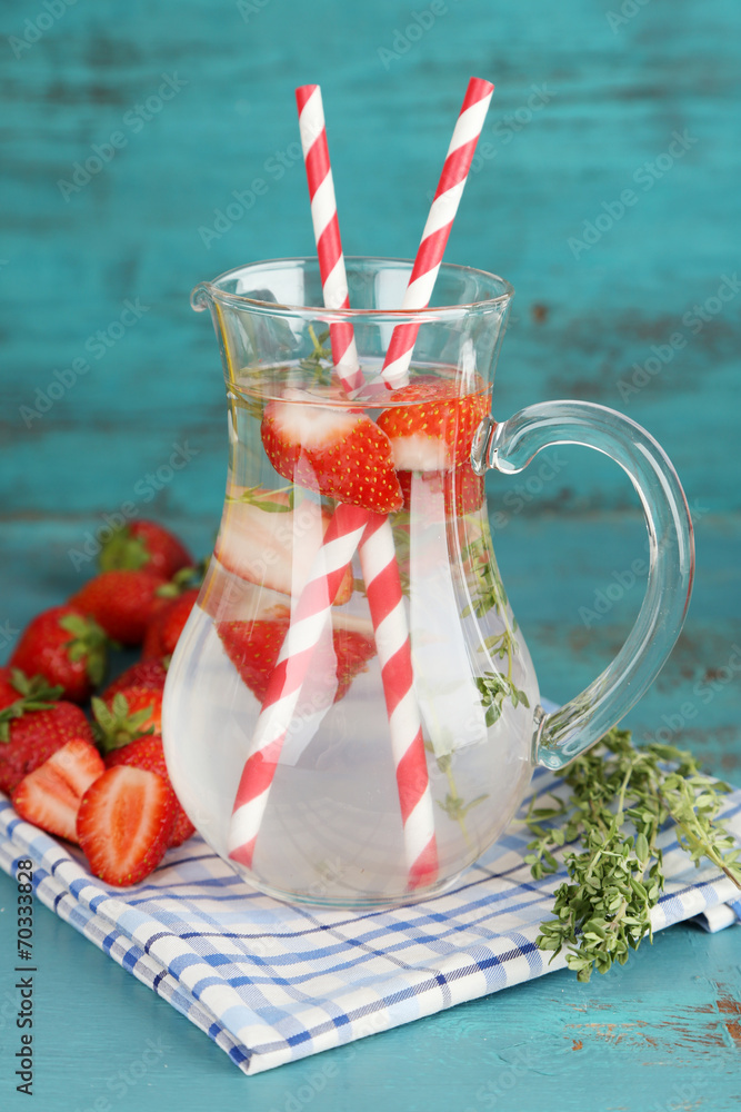 Tasty cool beverage with strawberries and thyme,