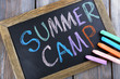 Text Summer camp written with chalk