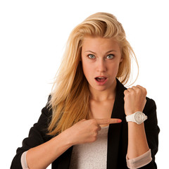 Sticker - Young blonde woman looks at her watch when she is being late iso