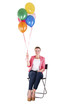 © Wisiel - woman with balloons over white background smiling