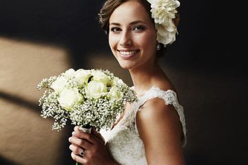 stunning young bride holding bouquet, portrait.