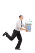 Man running with a recycle bin in his hands