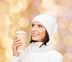 Sticker - smiling young woman in winter clothes with cup