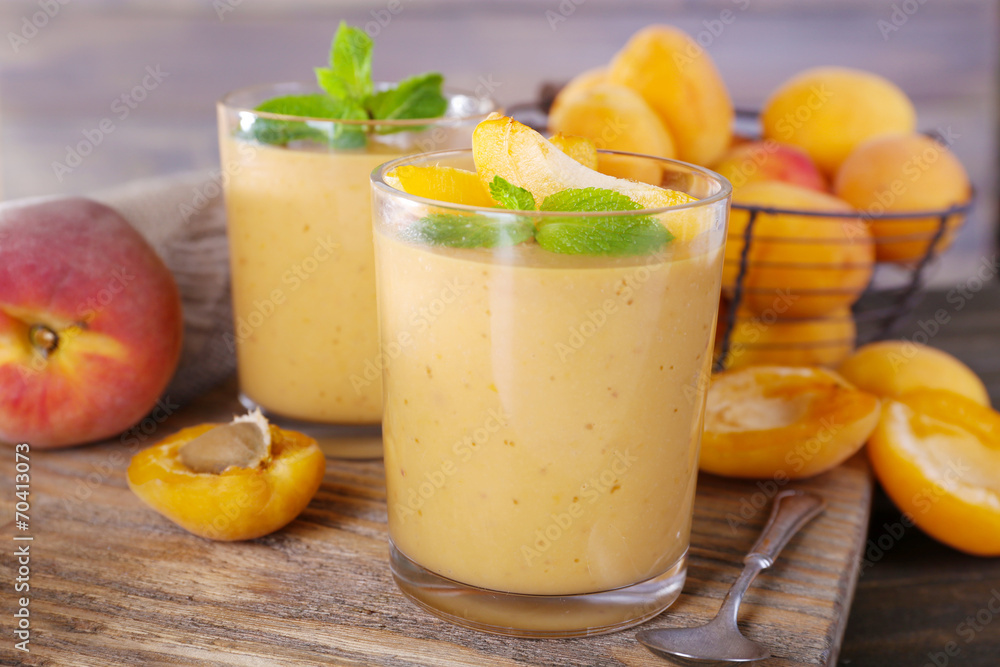 Apricot dessert in glasses on table close-up
