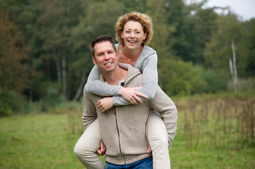 Wall Mural - Cheerful couple enjoying life outdoors