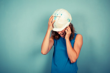 Wall Mural - Female builder on the phone