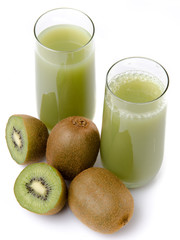 Two glasses of kiwi juice and some fresh kiwis