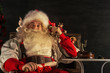© Milles Studio - Portrait of emotional Santa Claus calling phone at home