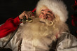 © Milles Studio - Portrait of emotional Santa Claus calling phone at home