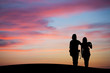 © Alex Koch - silhouetted couple watching sunset sky