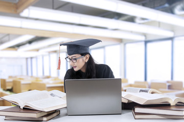 Wall Mural - Bachelor studying in library