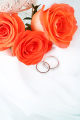 Wall Mural - Wedding rings on wedding bouquet, close-up, on light background