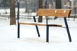 Stylish bench in winter park