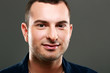 © Drobot Dean - Closeup portrait of happy man on gray background