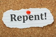 The word Repent on a cork notice board