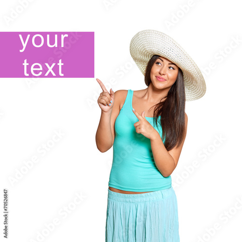 Fotografie, Obraz young sun-tanned woman smiling pointing up showing copy space