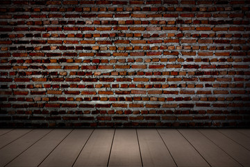  The red brick walls and wooden flooring.