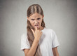 Disgusted annoyed teenager girl with finger in mouth gesture