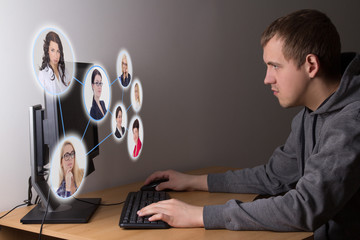 social media concept - young man using a computer