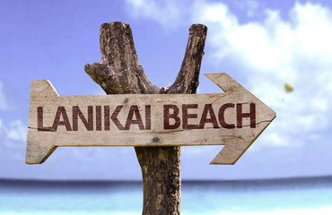 Wall Mural - Lanikai Beach wooden sign with a beach on background