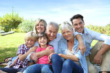 Fototapeta  - Happy 3 generation family in grandparents' backyard