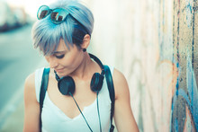 Young Beautiful Short Blue Hair Hipster Woman With Headphones Mu