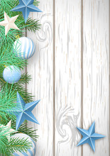 Christmas Wooden Background With Green Branches And Blue Ornamen