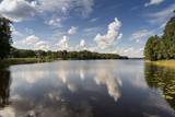 Fototapeta Tęcza - reflection of clouds in the lake with boardwalk