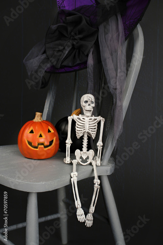 Halloween Pumpkins And Skeleton On Chair Buy This Stock Photo