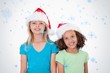 © WavebreakmediaMicro - Composite image of girls with christmas hats