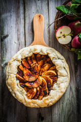 Wall Mural - Apple pie on rustic wooden background