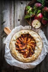 Wall Mural - Apple pie on rustic wooden background