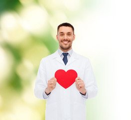 Wall Mural - smiling male doctor with red heart