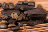 Fototapeta Mapy - chocolate and coffee beans on brown bamboo  background