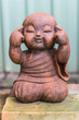 smiling buddhist novice made of clay, Thai style