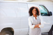 © Monkey Business - Woman Wearing Apron Standing In Front Of Van