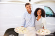 © Monkey Business - Couple Delivering Pizza Standing In Front Of Van