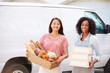 © Monkey Business - Female Bakers With Bread And Cakes Standing In Front Of Van