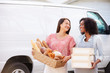 © Monkey Business - Female Bakers With Bread And Cakes Standing In Front Of Van