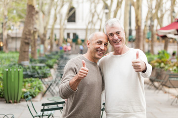 Wall Mural - Gay Couple showing Thumbs Up in New York