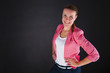 © Wisiel - woman in pink siute over dark background