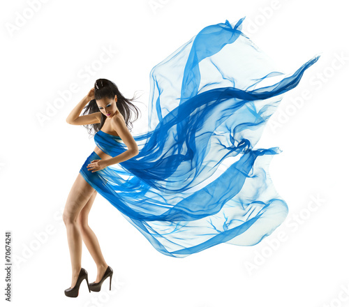 Fototapeta na wymiar Woman Sexy Dancing in Blue Dress. Fashion Model Waving Fabric